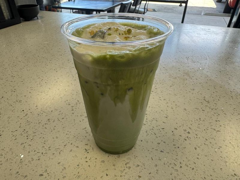 Pistachio Matcha Latte topped with crushed pistachio